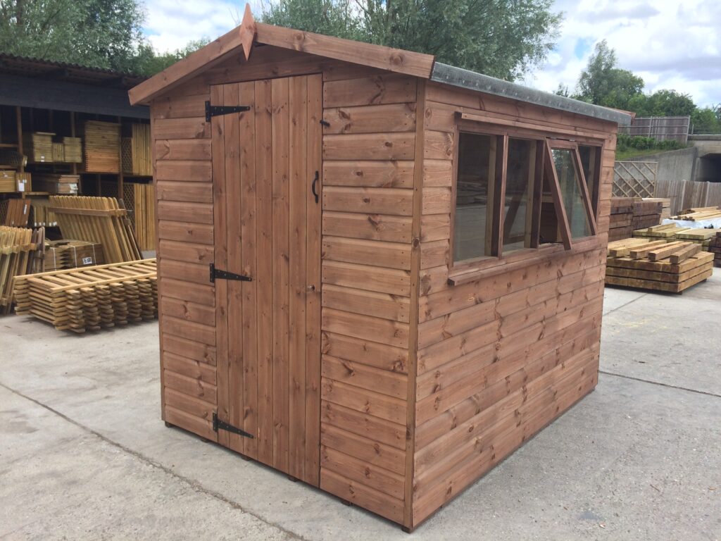 Classic timber apex shed with a side window and black T-hinges, pictured at our timber yard near Hertford before delivery to Harlow.