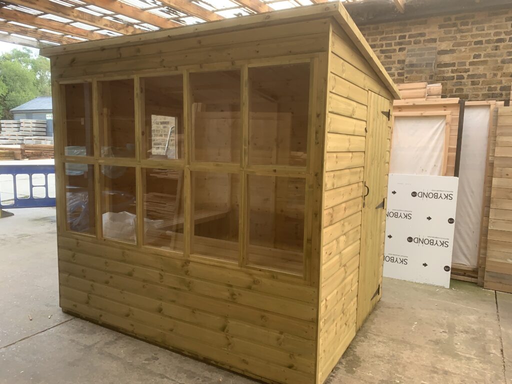 Timber garden potting shed with large glazing, manufactured by 414 Fencing & Timber Supplies.
